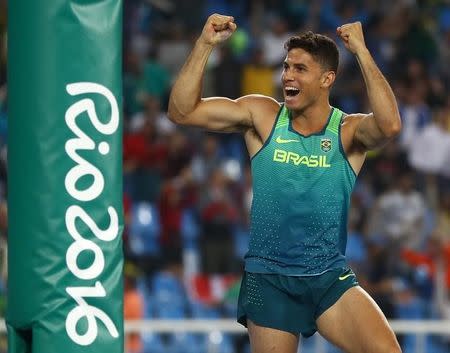 2016 Rio Olympics - Athletics - Final - Men's Pole Vault Final - Olympic Stadium - Rio de Janeiro, Brazil - 15/08/2016. Thiago Braz da Silva (BRA) of Brazil reacts after setting a new Olympic record on his way to winning the gold medal. REUTERS/Kai Pfaffenbach