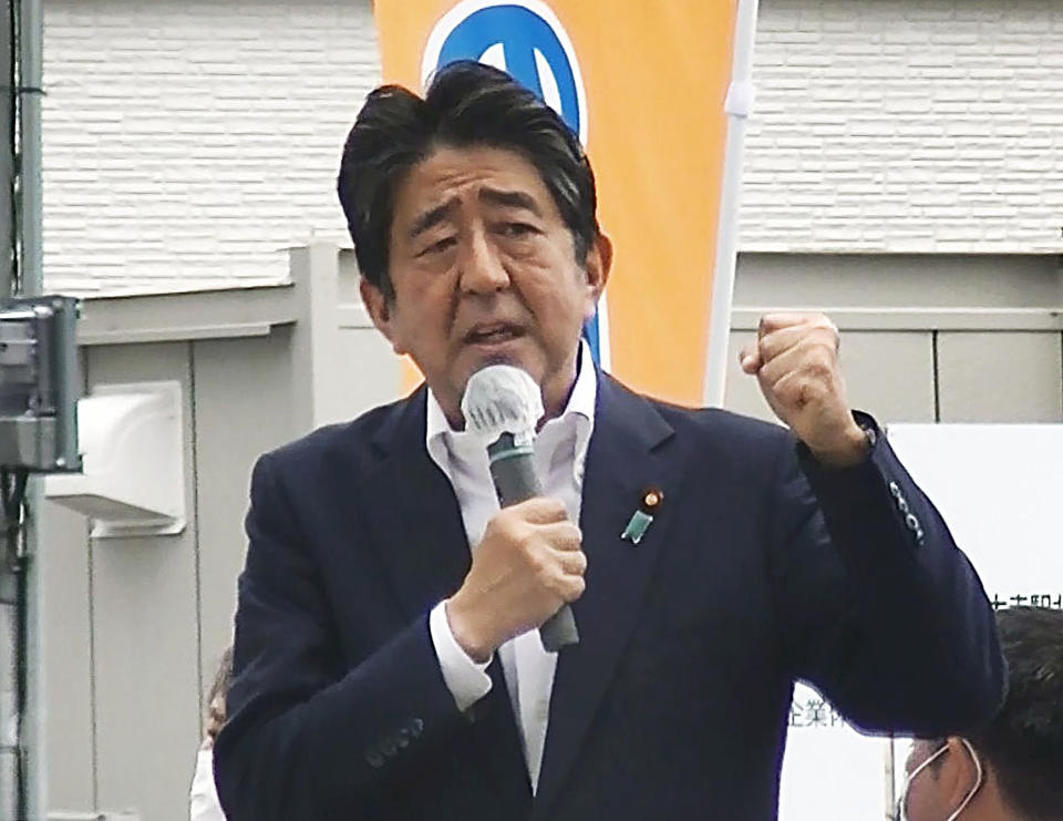 In this image from a video, Japan’s former Prime Minister Shinzo Abe makes a campaign speech in Nara, western Japan shortly before he was shot Friday, July 8, 2022. Former Japanese Prime Minister Shinzo Abe, a divisive arch-conservative and one of his nation's most powerful and influential figures, has died after being shot during a campaign speech Friday in western Japan, hospital officials said.(Kyodo News via AP)