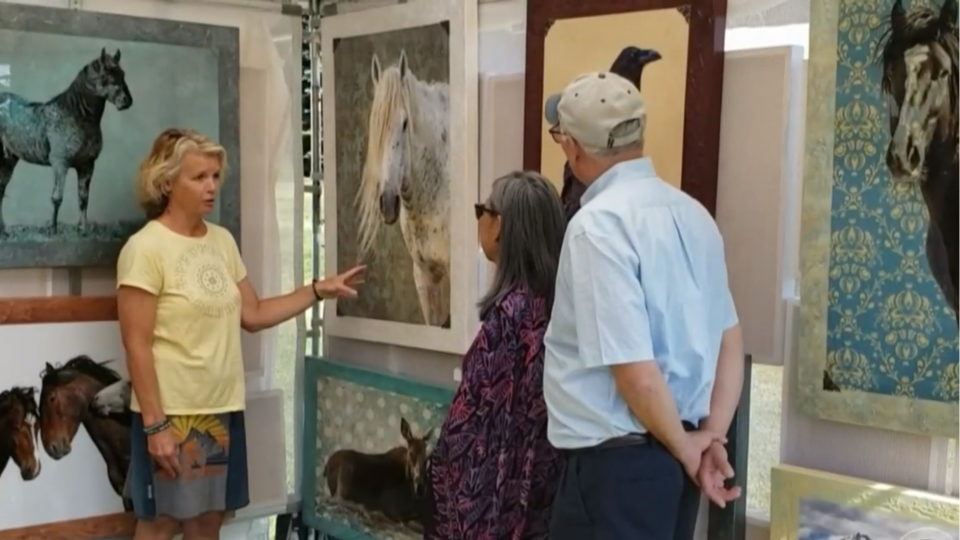 Wildlife photographer Mary Hone shows off her work.  / Credit: CBS News