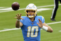 Los Angeles Chargers quarterback Justin Herbert pitches the ball during the first half of an NFL football game against the Jacksonville Jaguars Sunday, Oct. 25, 2020, in Inglewood, Calif. (AP Photo/Alex Gallardo)