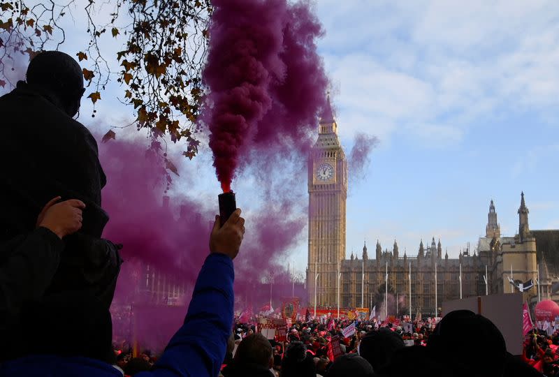 Royal Mail workers protest as members strike over pay and conditions, in London