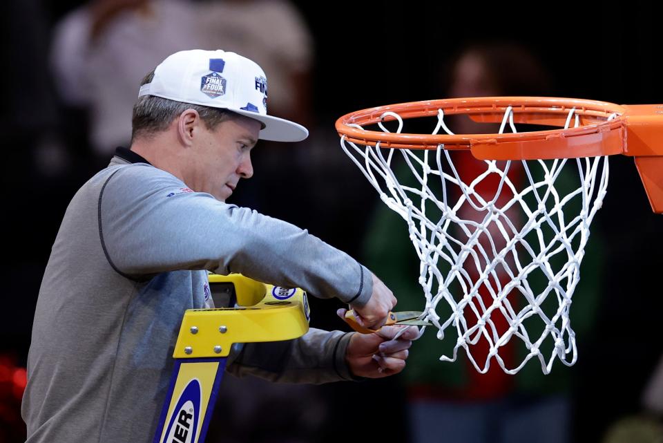 Florida Atlantic head coach Dusty May cuts the net after Florida Atlantic defeated Kansas State in an Elite 8 college basketball game in the NCAA Tournament's East Region final, Saturday, March 25, 2023, in New York. (AP Photo/Adam Hunger)