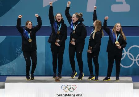 Curling - Pyeongchang 2018 Winter Olympics - Women's Final - Sweden v South Korea - Gangneung Curling Center - Gangneung, South Korea - February 25, 2018 - Gold medallists Anna Hasselborg of Sweden, and her teammates, Sara McManus, Agnes Knochenhauer, Sofia Mabergs and Jennie Waahlin celebrate during the victory ceremony. REUTERS/Cathal McNaughton