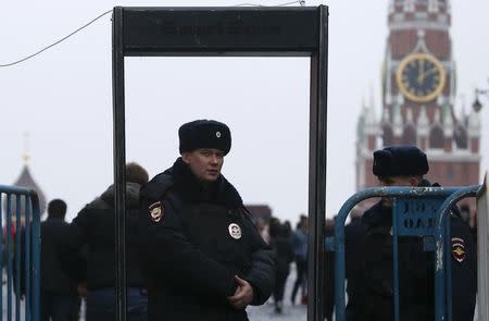 Policemen stand guard at the entrance to Red Square in central Moscow, Russia, April 2, 2017. REUTERS/Maxim Shemetov