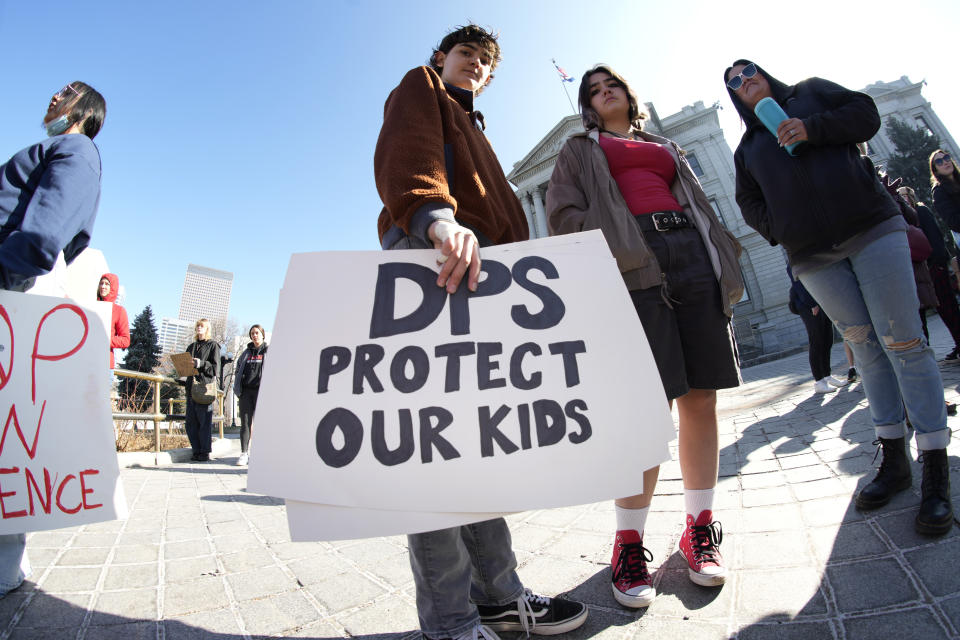 Students from East High School and West High School join forces to call for gun control measures to be considered by state lawmakers Thursday, March 23, 2023, during a rally outside the State Capitol in Denver. A shooting left two administrators injured at East High School on Wednesday, one of a series of gun-related events at the school in the past six weeks. (AP Photo/David Zalubowski)