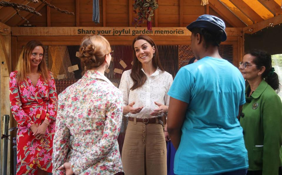 12) A very excited Kate chats with visitors.