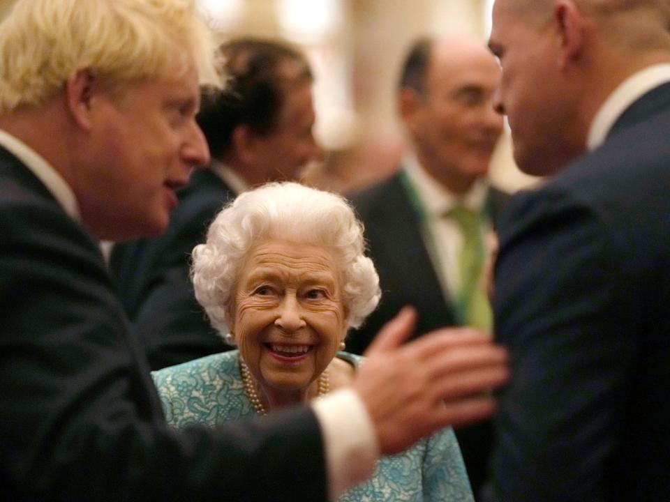 Boris Johnson talks to Queen Elizabeth II during a reception for international business and investment leaders at Windsor Castle