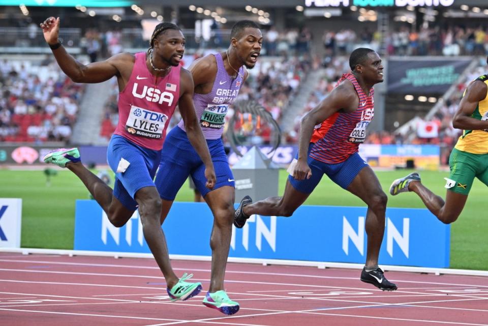 Noah Lyles battles with Zharnel Hughes in Budapest (EPA)