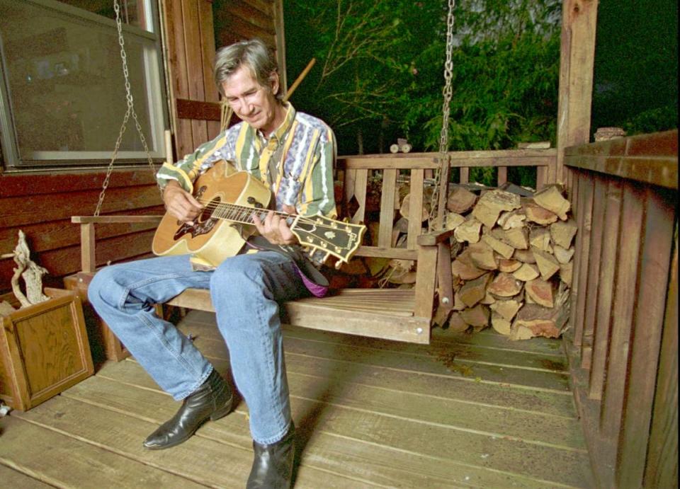 Townes Van Zandt plays his guitar in this Sept. 13, 1995 file photo.