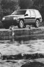<p>At first, the Grand Cherokee only came with Jeep's venerable 4.0-liter inline-six engine; later, a 5.2-liter V-8 joined the lineup, as well as a special high-output 5.9-liter V-8. The SUV rode on solid front and rear axles, and while two-wheel drive was standard, four-wheel-drive was available. </p>