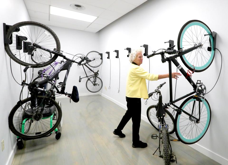 Commercial Property Partners property manager Lori Sumner shows off the tenants' bike room at 159 S. Main Street.