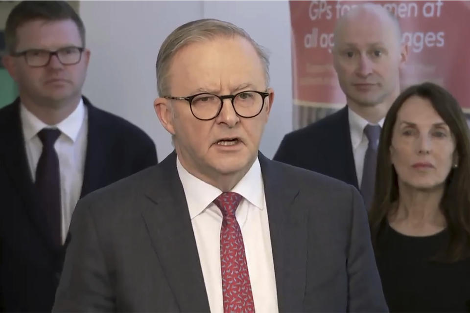In this image made from video, Australian Prime Minister Anthony Albanese, center, speaks to the media in Adelaide, Australia, on Sept. 26, 2023. Albanese said Tuesday that opinion polls suggest Indigenous Australians overwhelmingly support a proposal to create their own representative body to advise Parliament and have it enshrined in the constitution. (Australian Broadcasting Corporation via AP)