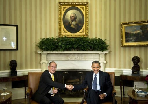 US President Barack Obama (R) and President of the Philippines Benigno Aquino shake hands after a meeting in Washington, DC. The United States and the Philippines called for freedom of navigation in the tense South China Sea as the White House offered a robust show of support for President Benigno Aquino