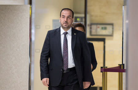 Naser al-Hariri, Head of the Syrian Negotiation Commission (SNC) arrives for a round of negotiations with U.N. Special Envoy of the Secretary-General for Syria Staffan de Mistura (not pictured), during the Intra Syria talks, at the European headquarters of the U.N. in Geneva, Switzerland December 14, 2017. REUTERS/Xu Jinquan/Pool