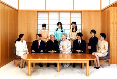 FILE PHOTO: Japanese Emperor Akihito (front, 3rd L) and Empress Michiko (front, 4th L) smile with their family members (front L-R) Crown Princess Masako, Crown Prince Naruhito, Prince Akishino, Prince Hisahito and Princess Kiko, (back L-R) Princess Aiko, Princess Mako and Princess Kako during a family photo session for the New Year at the Imperial Palace in Tokyo, in this handout picture taken November 15, 2015 and released on January 1, 2016 by the Imperial Household Agency of Japan. REUTERS/Imperial Household Agency of Japan/Handout via Reuters/File photo