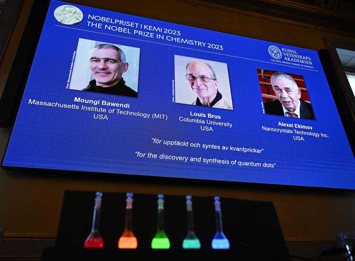 Louis Brus, center, shares Nobel recognition with two other quantum dots pioneers. <a href="https://www.gettyimages.com/detail/news-photo/screen-shows-this-years-laureates-us-chemist-moungi-bawendi-news-photo/1705016177?adppopup=true" rel="nofollow noopener" target="_blank" data-ylk="slk:Jonathan Nackstrand/AFP via Getty Images;elm:context_link;itc:0;sec:content-canvas" class="link ">Jonathan Nackstrand/AFP via Getty Images</a>