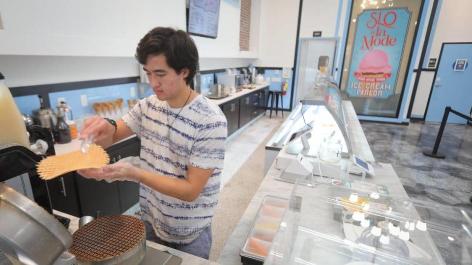 Max Bundy makes a fresh waffle cone at SLO à la Mode, which took the place of the former Doc Burnstein’s Ice Cream Lab location in downtown San Luis Obispo in July 2023.