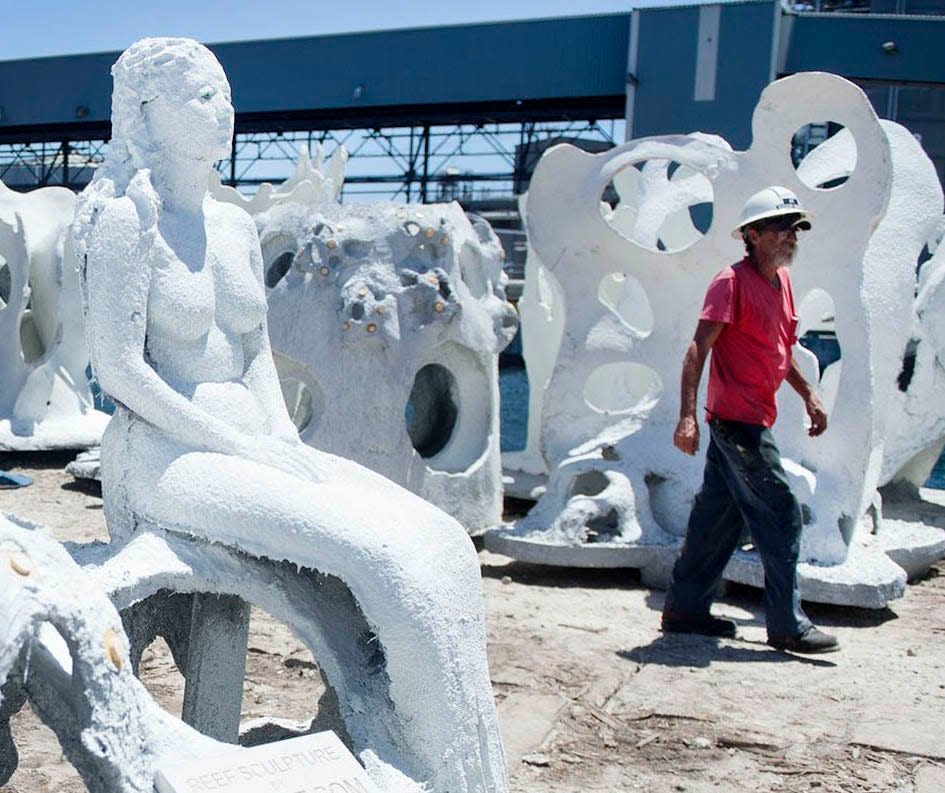 The mermaid sculptures were loaded onto a barge at Port of Palm Beach in Riviera Beach on Aug. 20, 2019, and were used to create an artificial reef of the north end of Palm Beach.