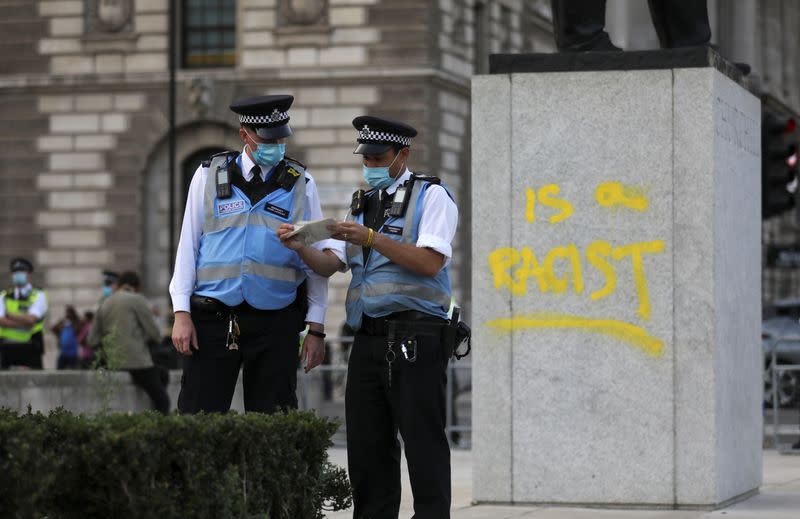 FILE PHOTO: A graffiti is seen on the statue of Winston Churchill, in London