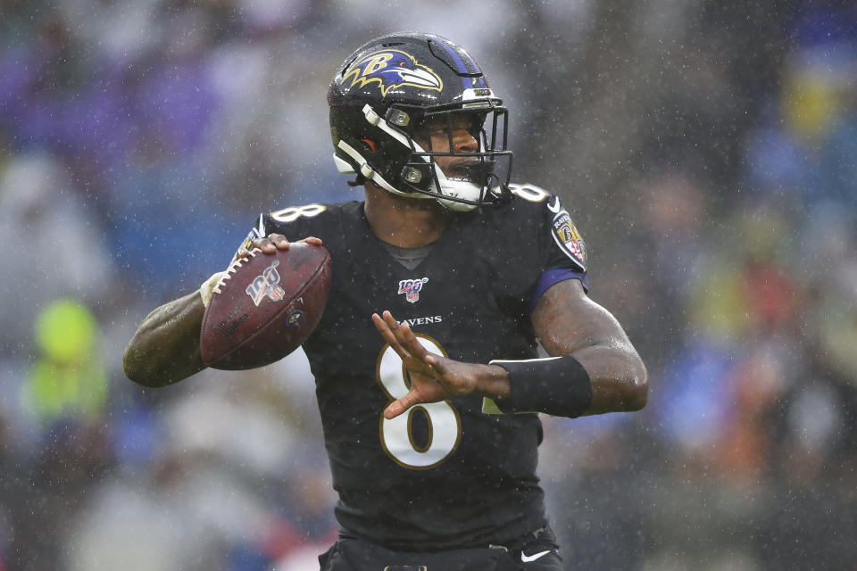 Baltimore Ravens quarterback Lamar Jackson (8) looks downfield to pass the ball against San Francisco 49ers in the first half of an NFL football game, Sunday, Dec. 1, 2019, in Baltimore, Md. (AP Photo/Gail Burton)