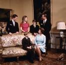 <p>Queen Elizabeth, Prince Philip, and their four children chat in one of the palace's several living rooms.</p>