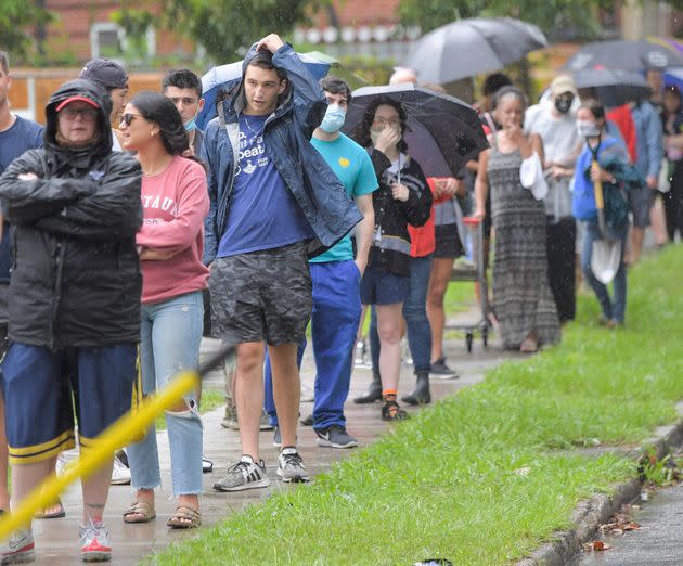 People stand in line to pick up sandbags at a city run sandbag distribution location at the Dryades YMCA in anticipation of Hurricane Ida in New Orleans, La., Friday, Aug. 27, 2021. (Photo: Max Becherer/The Advocate via AP)
