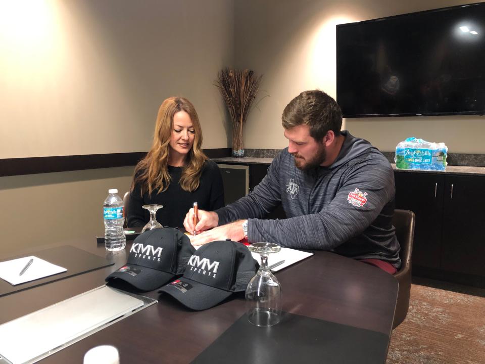 Kelli Masters, pictured with Texas A&M's Keaton Sutherland who signed with the Bengals, runs her own sports agency.