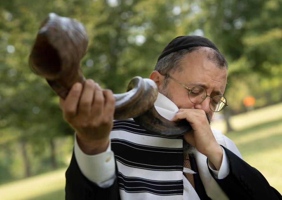 Rabbi Yitzchok Tiechtel from Chabad of Nashville practices the sounding of the shofar as he prepares for their Shofar in the Park ceremony at Edwin Warner Park Friday, Sept. 18, 2020 in Nashville, Tenn. Rabbi Tiechtel will be sounding the shofar in the park Sunday to celebrate Rosh Hashanah in a safer, outdoor space because of the pandemic.