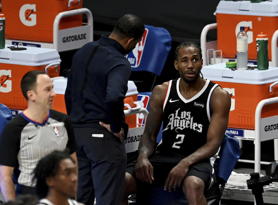 Los Angeles Clippers' Kawhi Leonard sits on the bench after suffering an injury during the second half against the Boston Celtics in an NBA basketball game Friday, Feb. 5, 2021, in Los Angeles. (Keith Birmingham/The Orange County Register via AP)