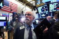 Traders work on the floor of the New York Stock Exchange