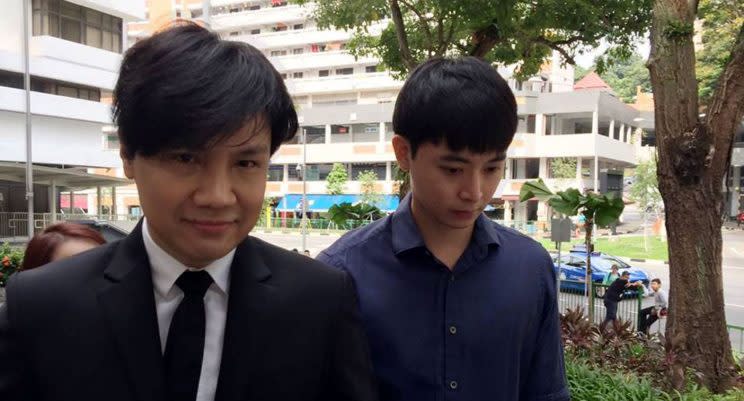 Former Mediacorp actor Aloysius Pang (right) outside the States Court on 22 June. (Photo: Yahoo Lifestyle Singapore)