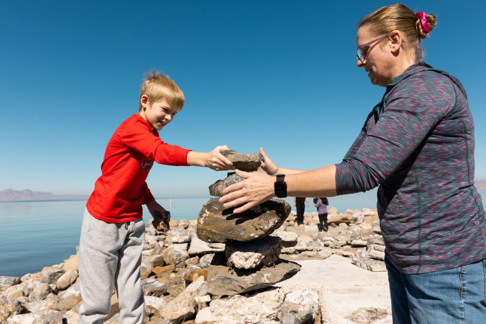 Elise and Maddox Downs build a cairn at Great Salt Lake State Park in Magna on Friday, Oct. 6, 2023. | Megan Nielsen, Deseret News