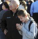 Students are reunited with families at a staging ground set up at the Roswell Mall following an early morning shooting at Berrendo Middle School in Roswell, New Mexico January 14, 2014. REUTERS/Mark Wilson/Roswell Daily Record