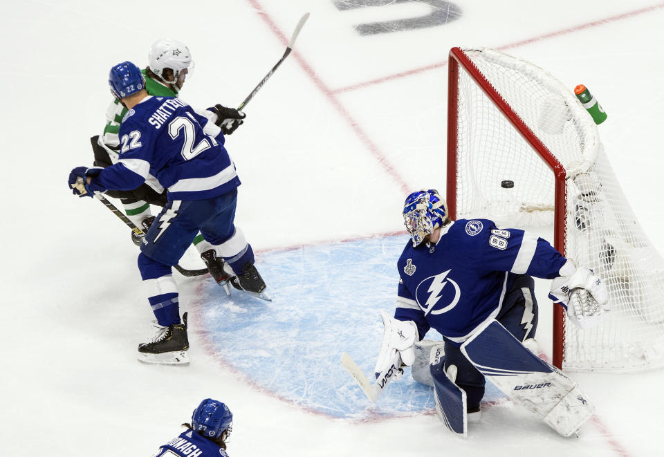 Dallas Stars' Mattias Janmark (13) scores against Tampa Bay Lightning goalie Andrei Vasilevskiy (88) as Lightning's Kevin Shattenkirk (22) defends during third-period NHL Stanley Cup finals hockey action in Edmonton, Alberta, Monday, Sept. 21, 2020. (Jason Franson/The Canadian Press via AP)