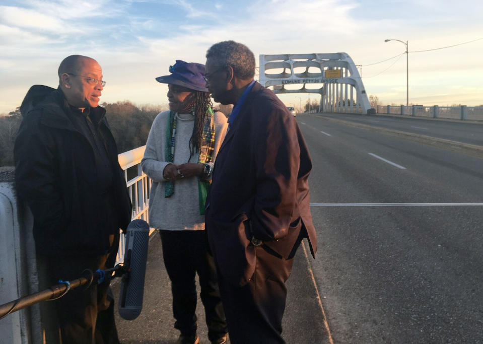 This image released by Sony Pictures Classics shows Jeffery Robinson, left, with Faya Ora Rose Touré and Sen. Hank Sanders on the Edmund Pettus Bridge in Selma, Alabama, in a scene from "Who We Are." (Sony Pictures Classics via AP)