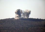 <p>Smoke rises in the air from Turkish forces shelling inside Syria, as seen from the outskirts of the town of Kilis, Turkey, Tuesday, Jan. 30, 2018. (Photo: Lefteris Pitarakis/AP) </p>