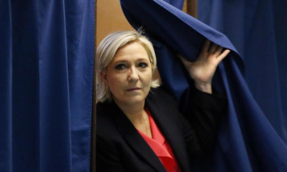 Marine Le Pen exits a voting booth in France.