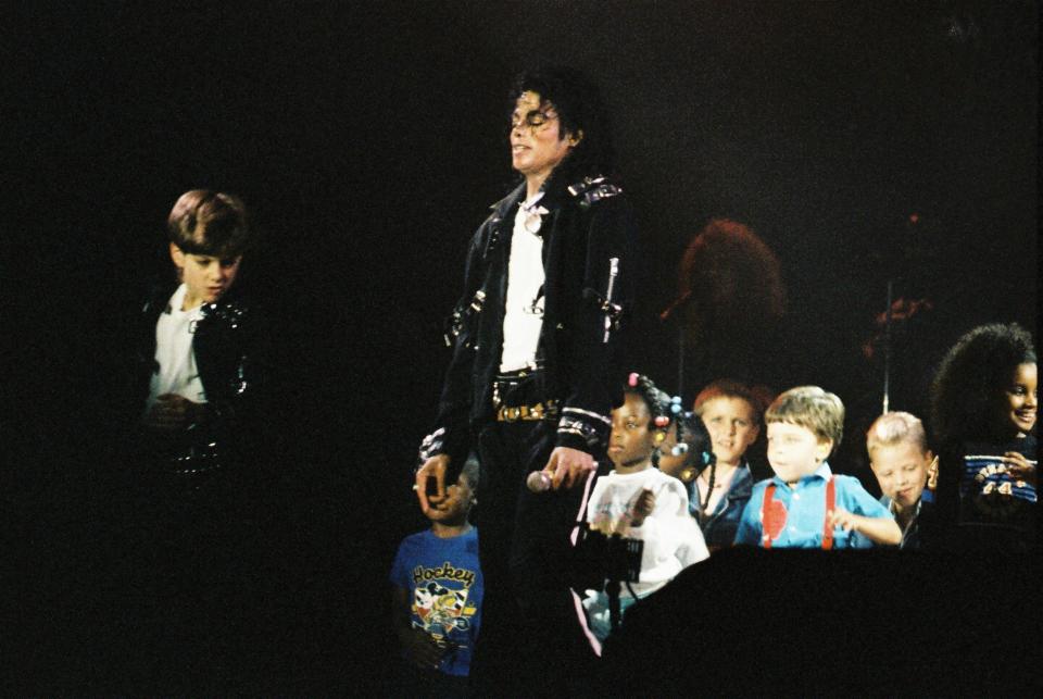 Michael Jackson performing with children during his 1988 "Bad" tour. (Photo: Peter Still via Getty Images)