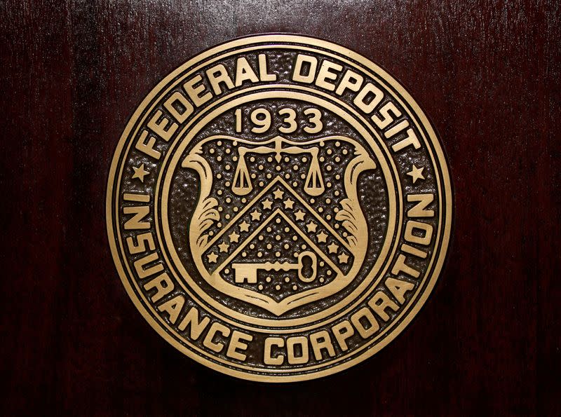 FILE PHOTO: FILE PHOTO: The Federal Deposit Insurance Corp (FDIC) logo is seen at the FDIC headquarters in Washington