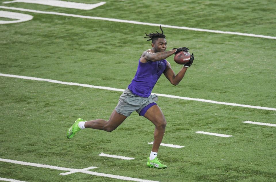 Justyn Ross, former Clemson wide receiver, catches a ball in a drill during Clemson Football Pro Day at the Poe indoor football facility in Clemson, S.C. Thursday, March 17, 2022. Players evaluated are considered by scouts of professional teams for the 2022 NFL Draft in Paradise, Nevada from April 28-30, 2022.