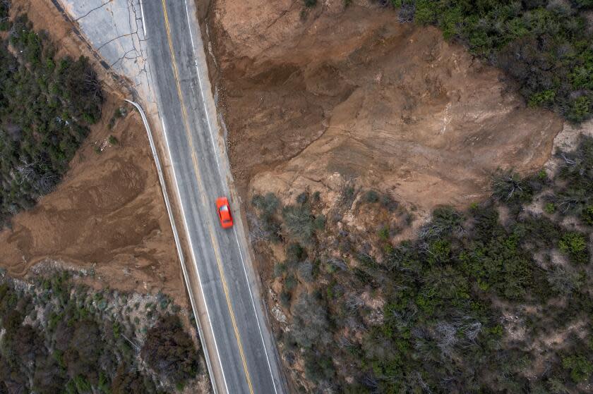 LA CANADA-FLINTRIDGE, CA - MARCH 30 : In an aerial view, landslides along the Angeles Crest Highway (SR 2) continue to grow as the latest in a parade of storms that have created disasters across the state all year breaks up on March 30, 2023 near La Cañada-Flintridge, California. In striking contrast to the previous years of severe to extreme drought, more than a dozen atmospheric river storm events have steadily swept in from the Pacific Ocean bringing extreme weather, including huge surf, unprecedented rainfalls, widespread flooding and record mountain snowpack depths that have covered two story houses and kept many people snowbound without fresh supplies for weeks. The heavy rain and snowmelt have refilled most major reservoirs, which had nearly dried up in recent years, giving at least temporary relief from the worst drought in 1,200 years. (Photo by David McNew/Getty Images)