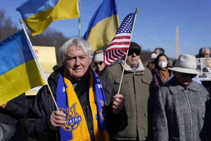 People gather for a vigil in solidarity with Ukraine, Sunday, Feb. 20, 2022, at the Lincoln Memorial in Washington. (AP Photo/Patrick Semansky)