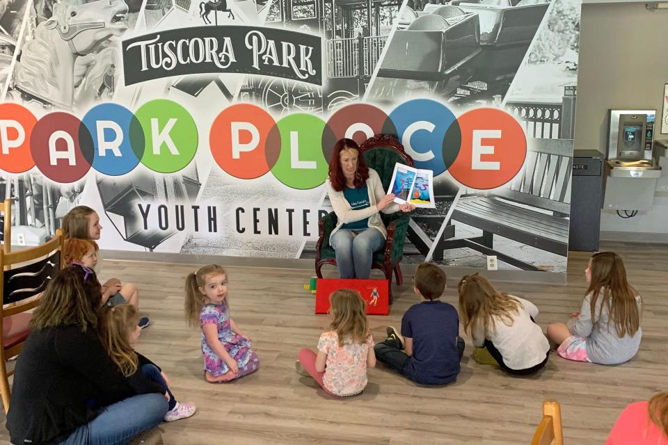 Story time is a great time for young visitors at the Park Place Youth Center at Tuscora Park.