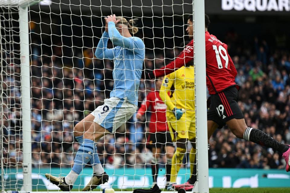 Erling Haaland contrived to produce one of the most incredible misses of the season, although scored late on (AFP via Getty Images)