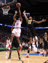 PORTLAND, OR - MARCH 17: Remy Abell #23 of the Indiana Hoosiers goes up for a shot against Bradford Burgess #20 of the Virginia Commonwealth Rams in the second half during the third round of the 2012 NCAA Men's Basketball Tournament at the Rose Garden Arena on March 17, 2012 in Portland, Oregon. (Photo by Jed Jacobsohn/Getty Images)