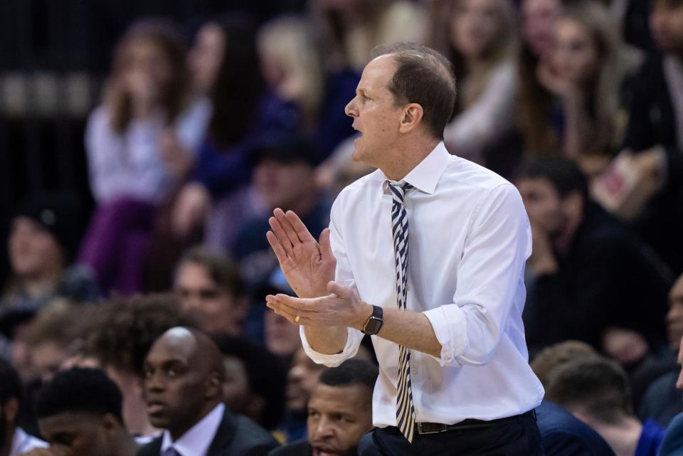 Washington coach Mike Hopkins encourages the team against Stanford last season. Hopkins is facing increased pressure to try and get the Huskies back into the NCAA Tournament after missing the tourney the past four seasons. (AP File Photo/Stephen Brashear)