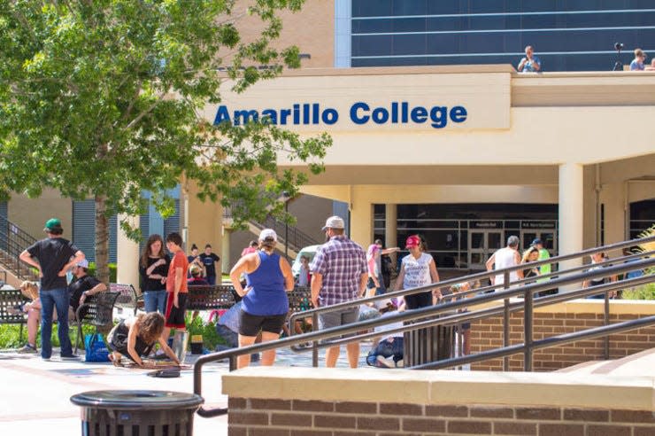 Spectators admire the work of the sidewalk chalk artists during a previous Amarillo College Chalk It Up sidewalk art contest. This year's event is scheduled for July 29.