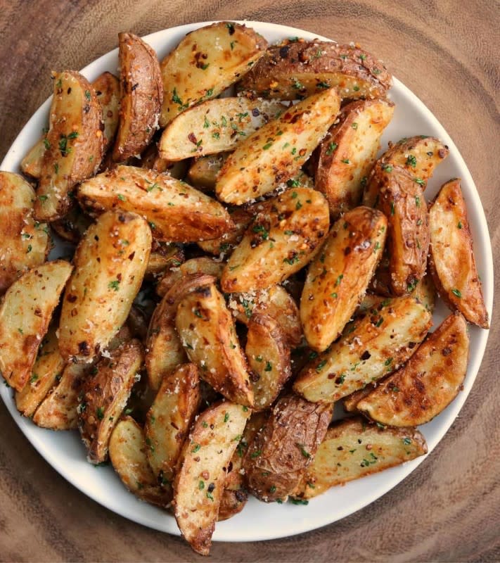 <p>Kinda Healthy Recipes</p><p>Red potato wedges are air fried in a blend of crushed garlic and red pepper, olive oil and parmesan cheese.</p><p><strong>Get the recipe: <a href="https://masonfit.com/garlic-parmesan-air-fryer-red-potatoes/" rel="nofollow noopener" target="_blank" data-ylk="slk:Garlic Parmesan Air Fryer Red Potatoes;elm:context_link;itc:0;sec:content-canvas" class="link rapid-noclick-resp">Garlic Parmesan Air Fryer Red Potatoes</a></strong></p><p><strong>Related: <a href="https://parade.com/food/air-fryer-breakfast-recipes" rel="nofollow noopener" target="_blank" data-ylk="slk:50 Best Air Fryer Breakfast Recipes;elm:context_link;itc:0;sec:content-canvas" class="link rapid-noclick-resp">50 Best Air Fryer Breakfast Recipes</a></strong></p>