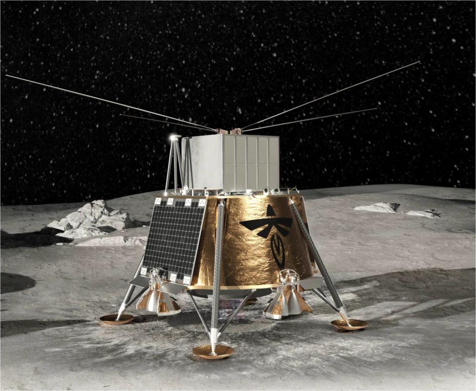 A roughly cube-shaped spacecraft wrapped in gold foil on the moon