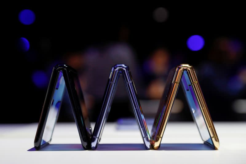 A trio of Samsung Galaxy Z Flip foldable smartphones is seen during Samsung Galaxy Unpacked 2020 in San Francisco